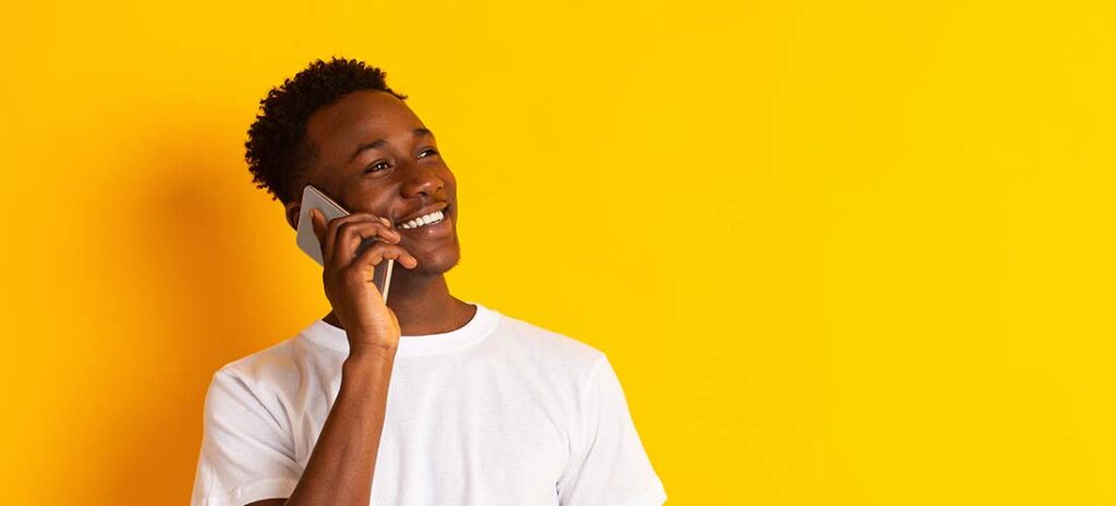 Young man talking to virtual agent