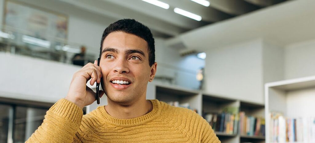 Happy man talking on the phone